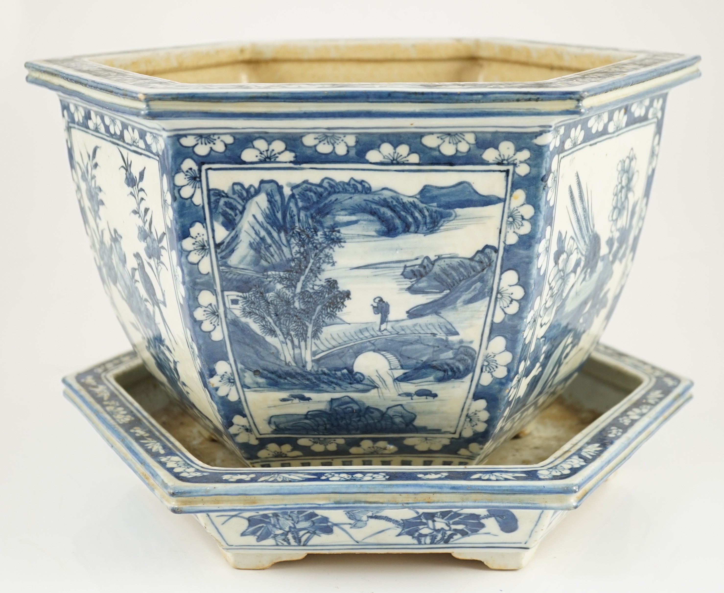 A Chinese hexagonal blue and white planter and underdish, 19th century, 35cm wide, two rim chips